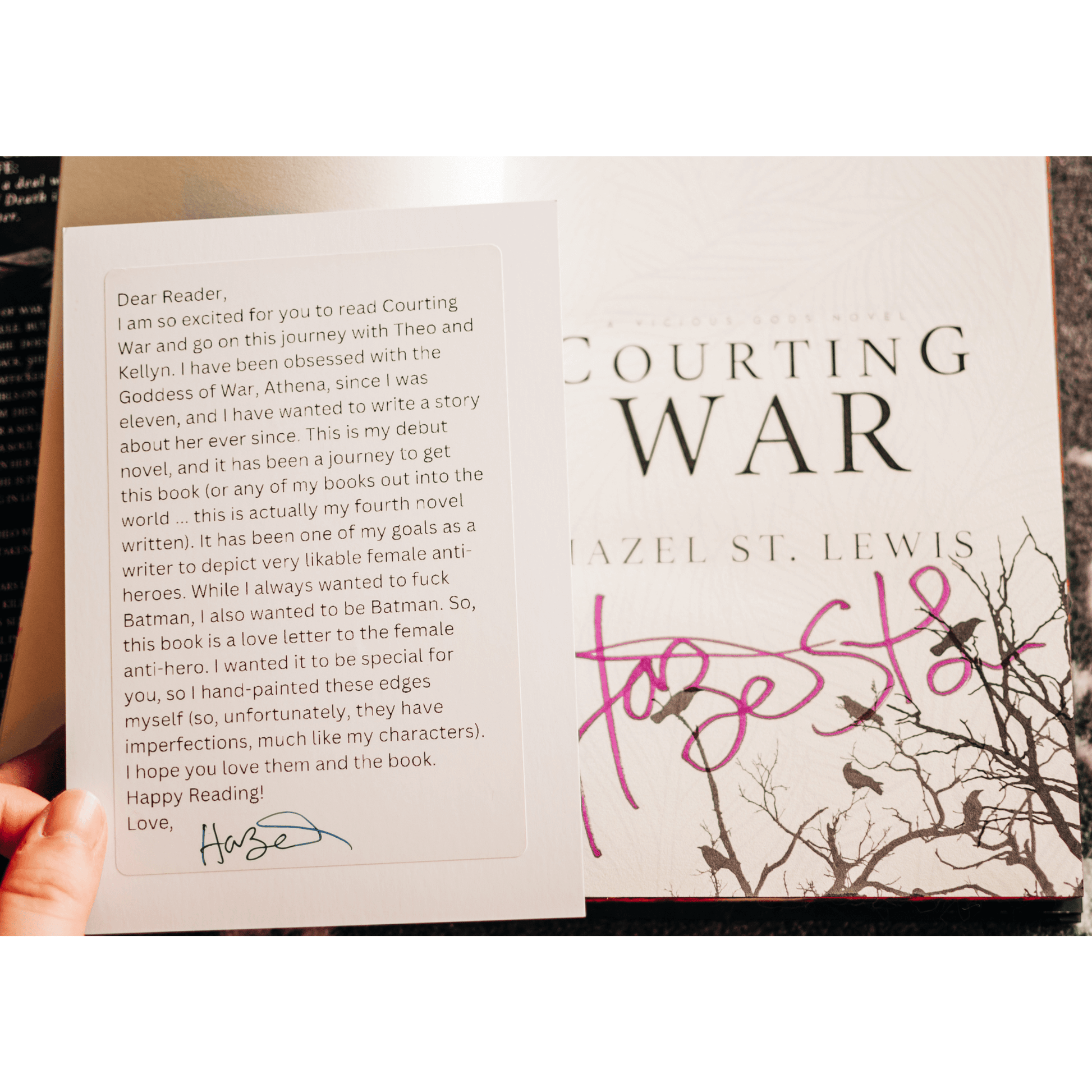 Handwritten note from Hazel St. Lewis about her book 'Courting War' with a signed cover.