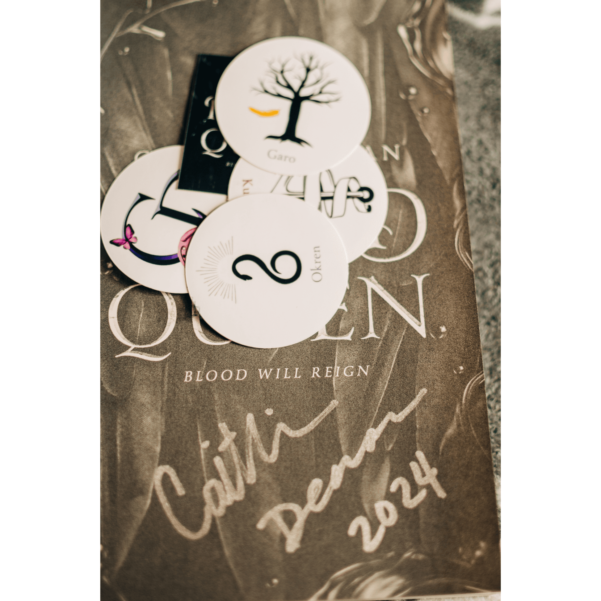 Signed fantasy book with custom art cards featuring enchanted themes and characters, perfect for cozy reading.
