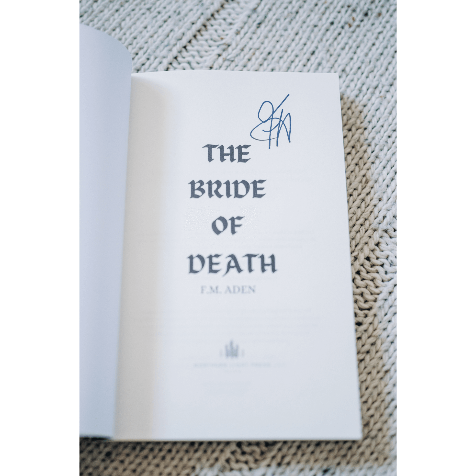 Signed inside cover of 'The Bride of Death' by F.M. Aden, ideal for fantasy romance book lovers.