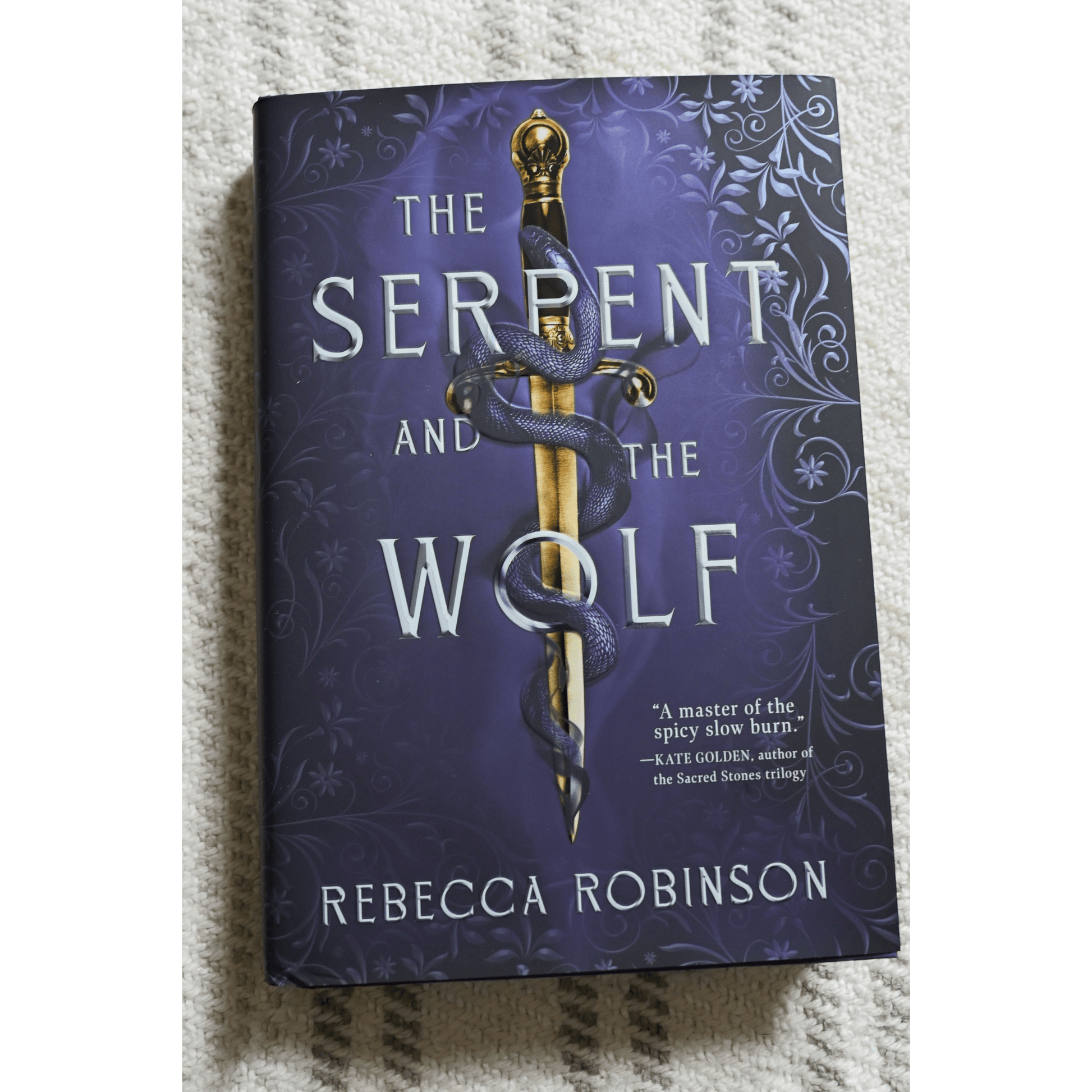 Cover of 'The Serpent and the Wolf' by Rebecca Robinson, a spicy fantasy romance read for avid fans.